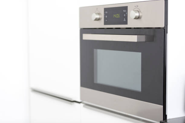 A sleek modern wall oven featuring a digital display for easy temperature and timer settings.