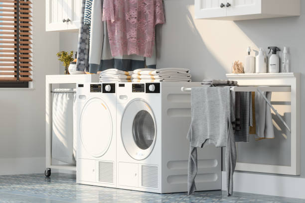 A laundry room featuring a washer and dryer set, neatly arranged for efficient laundry tasks.